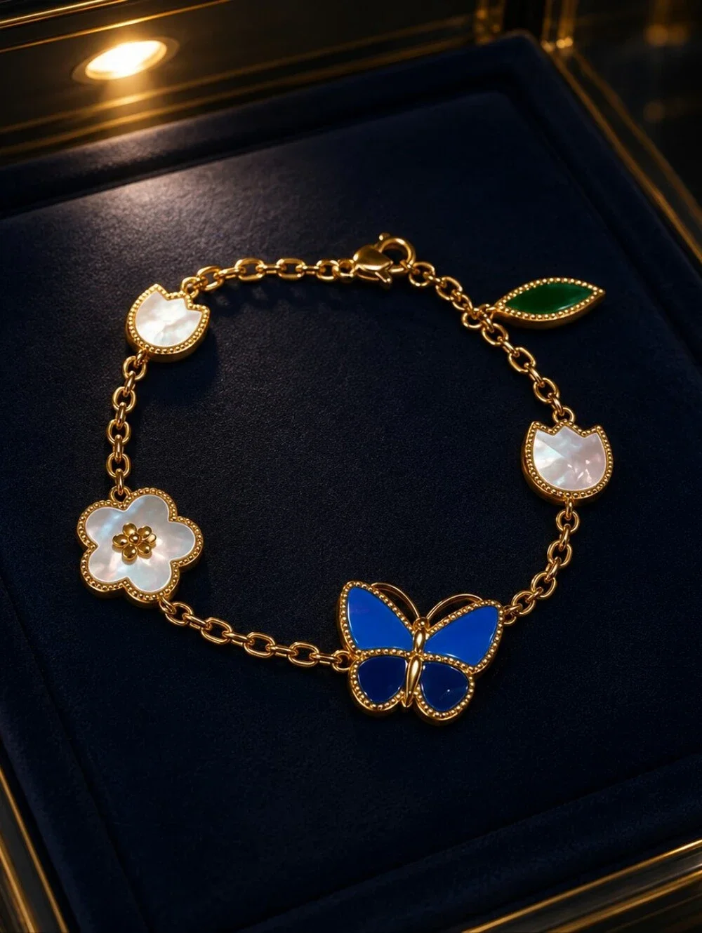 Gold Charm Bracelet with Blue Butterfly and Mother-of-Pearl Accents